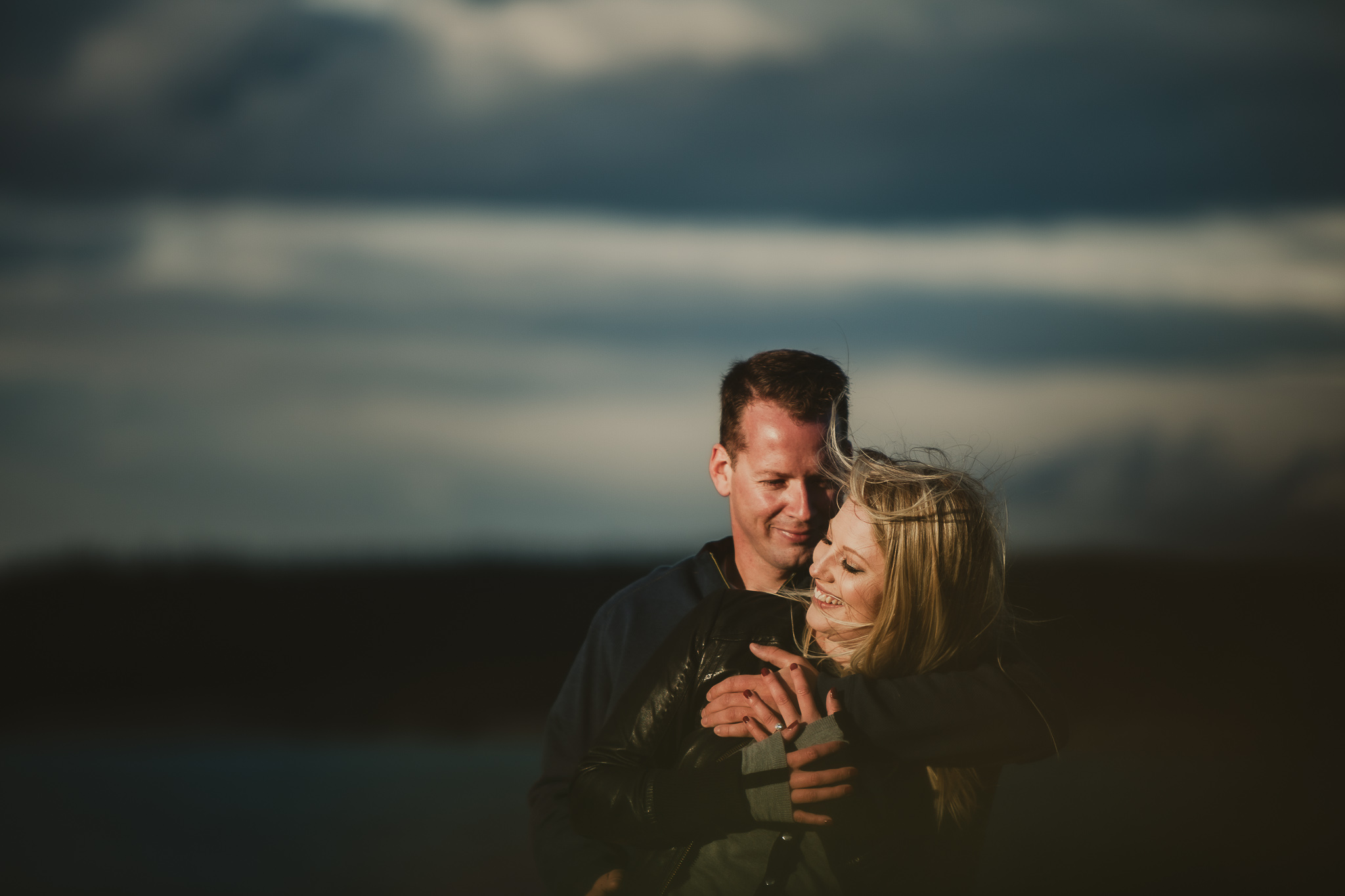 couple in an embrace in the mountains