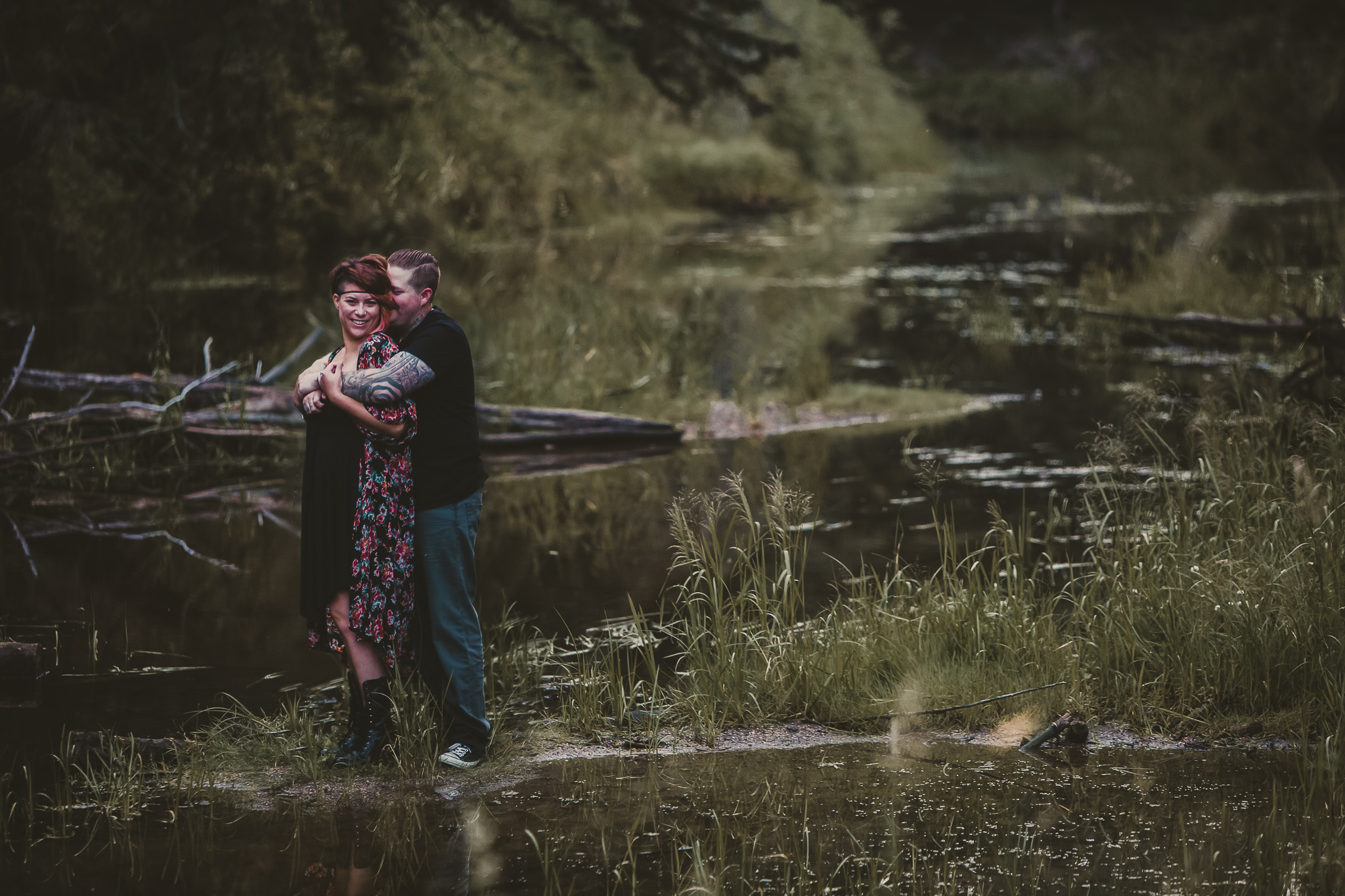 man holding woman by a creek
