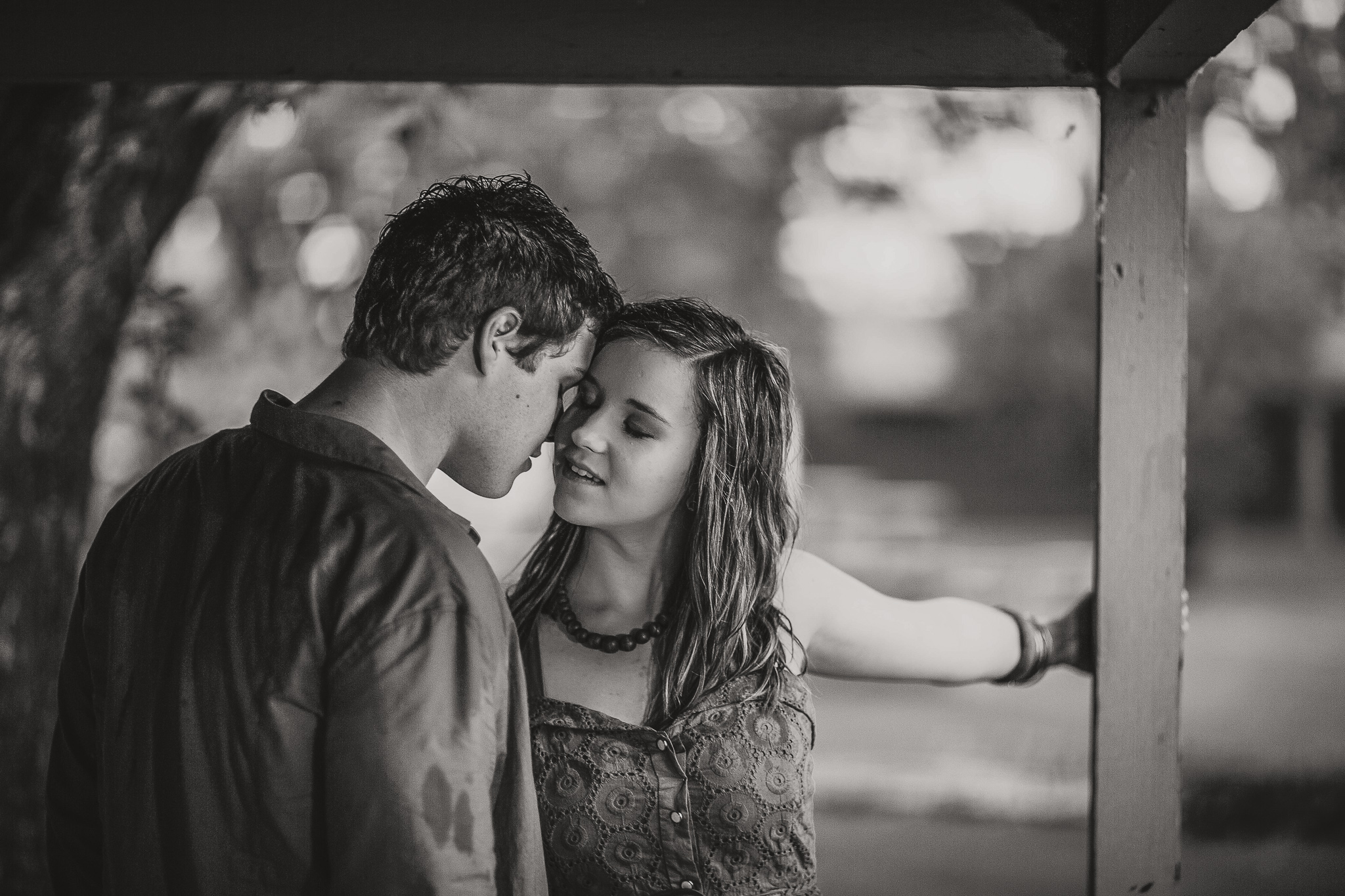 woman whispering to a man