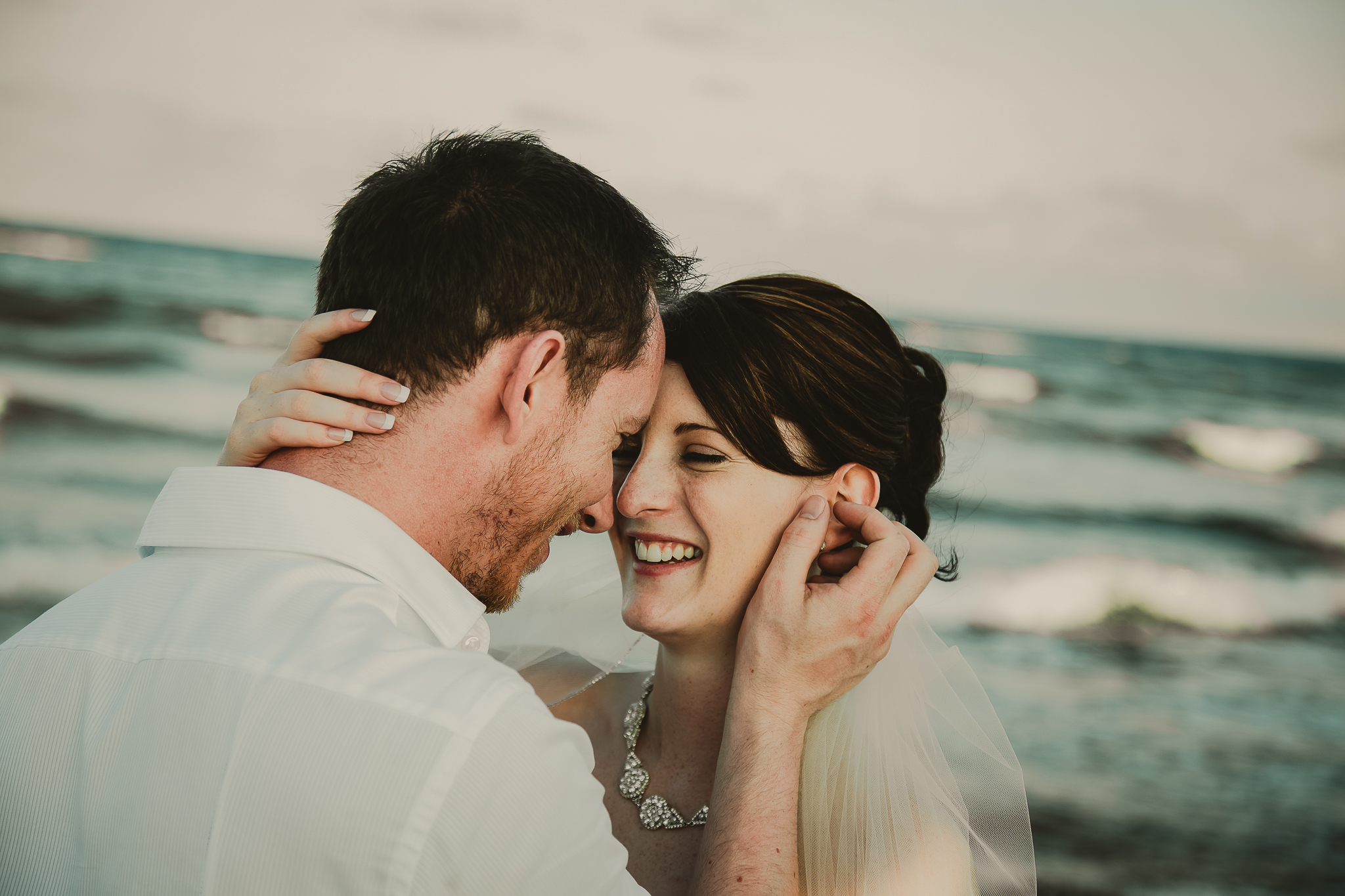 wedding couple looking at one another and laughing