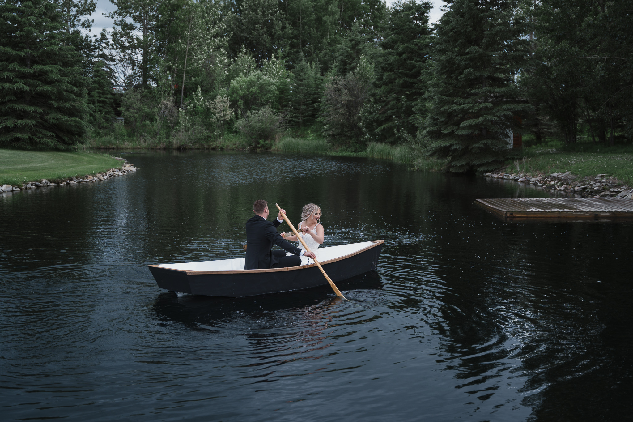 bride and groom in a row boat