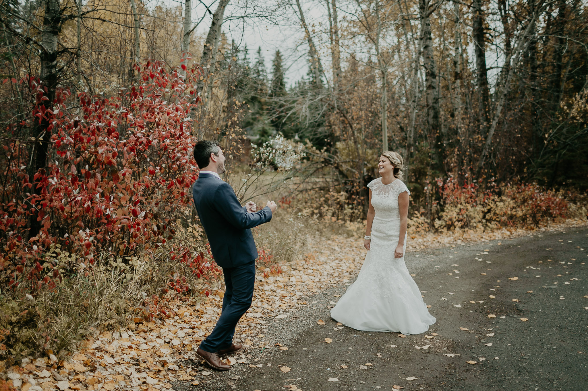 groom and bride standing together and smiling