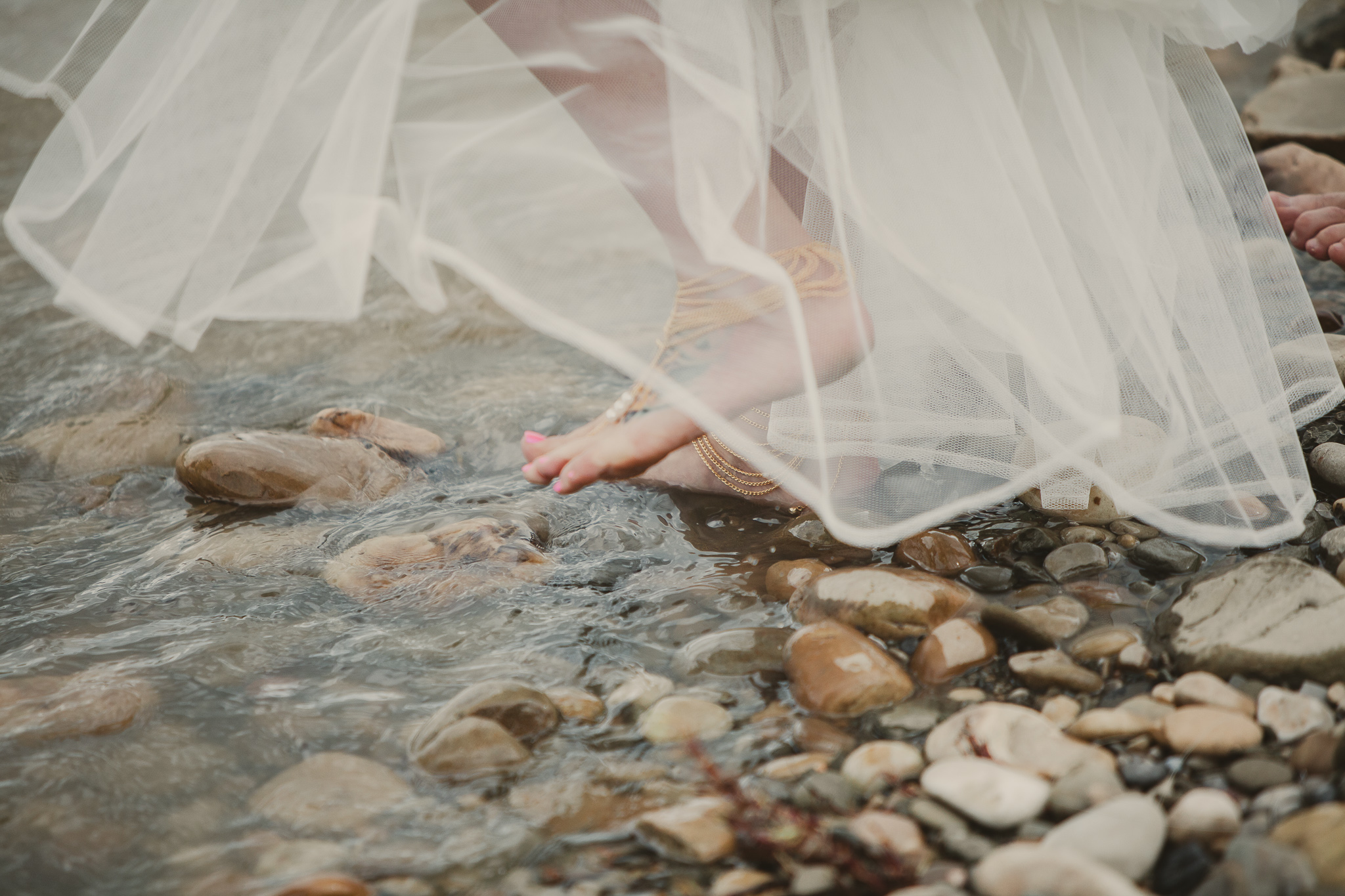 dress and feet in the river