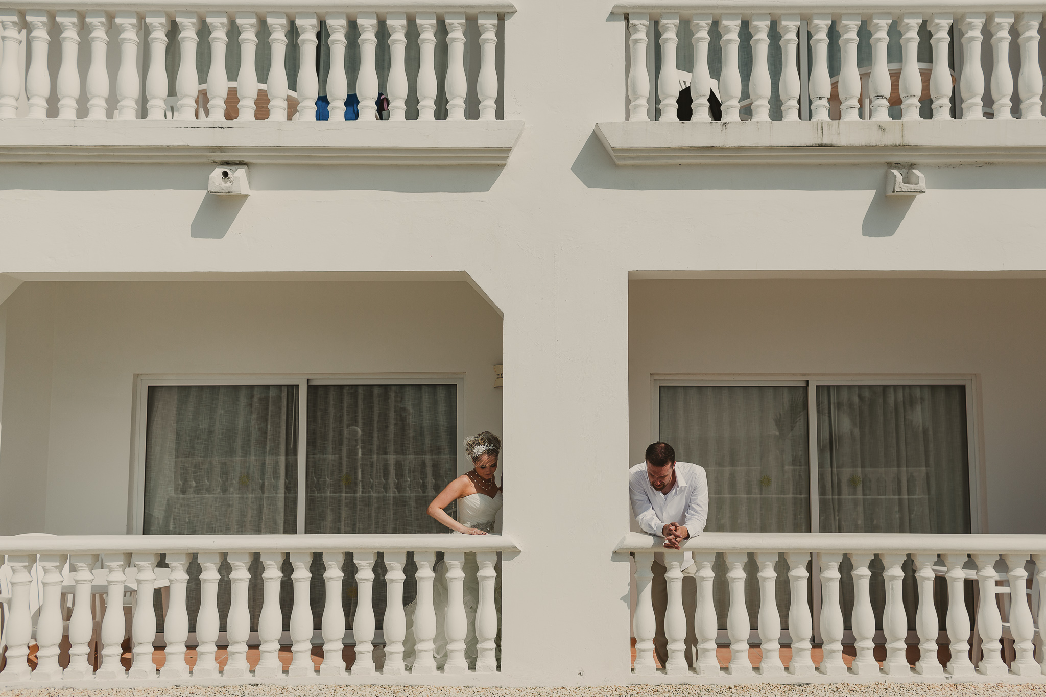 bride and groom on a balcony