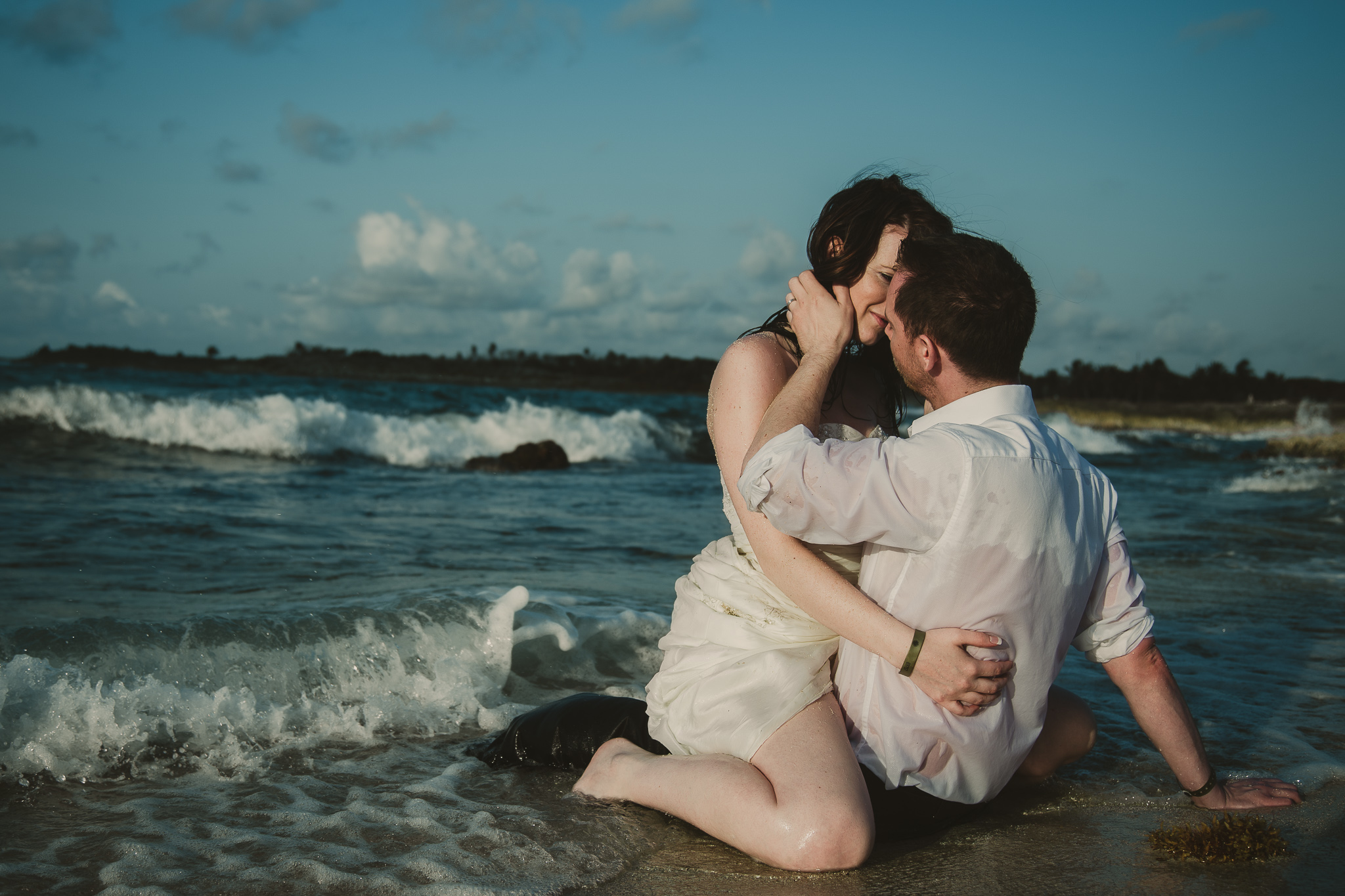 couple hugging in the ocean