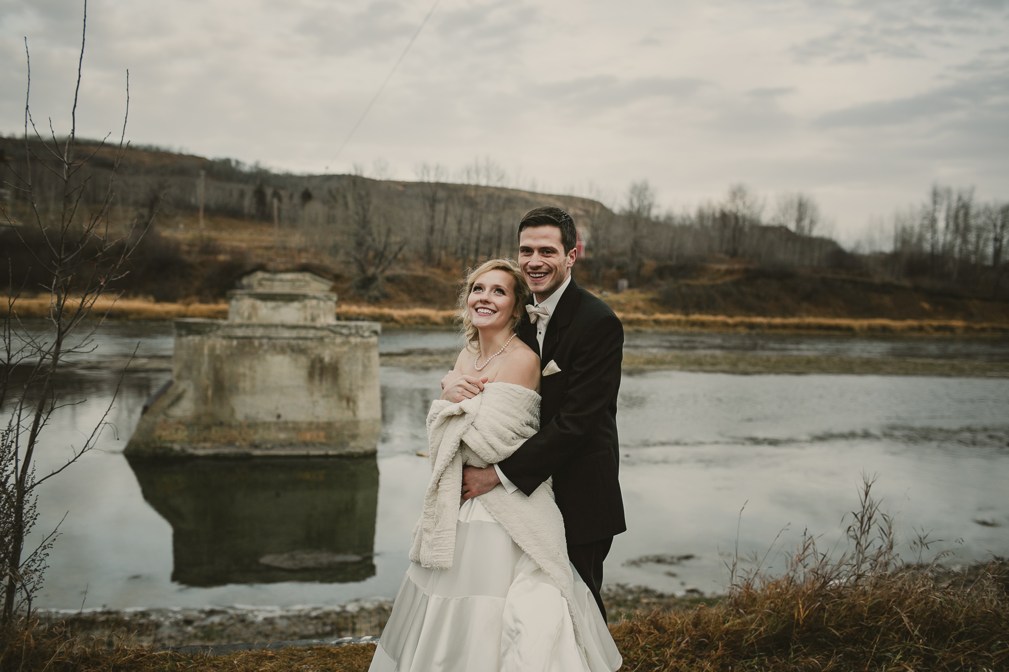 bride and groom hugging