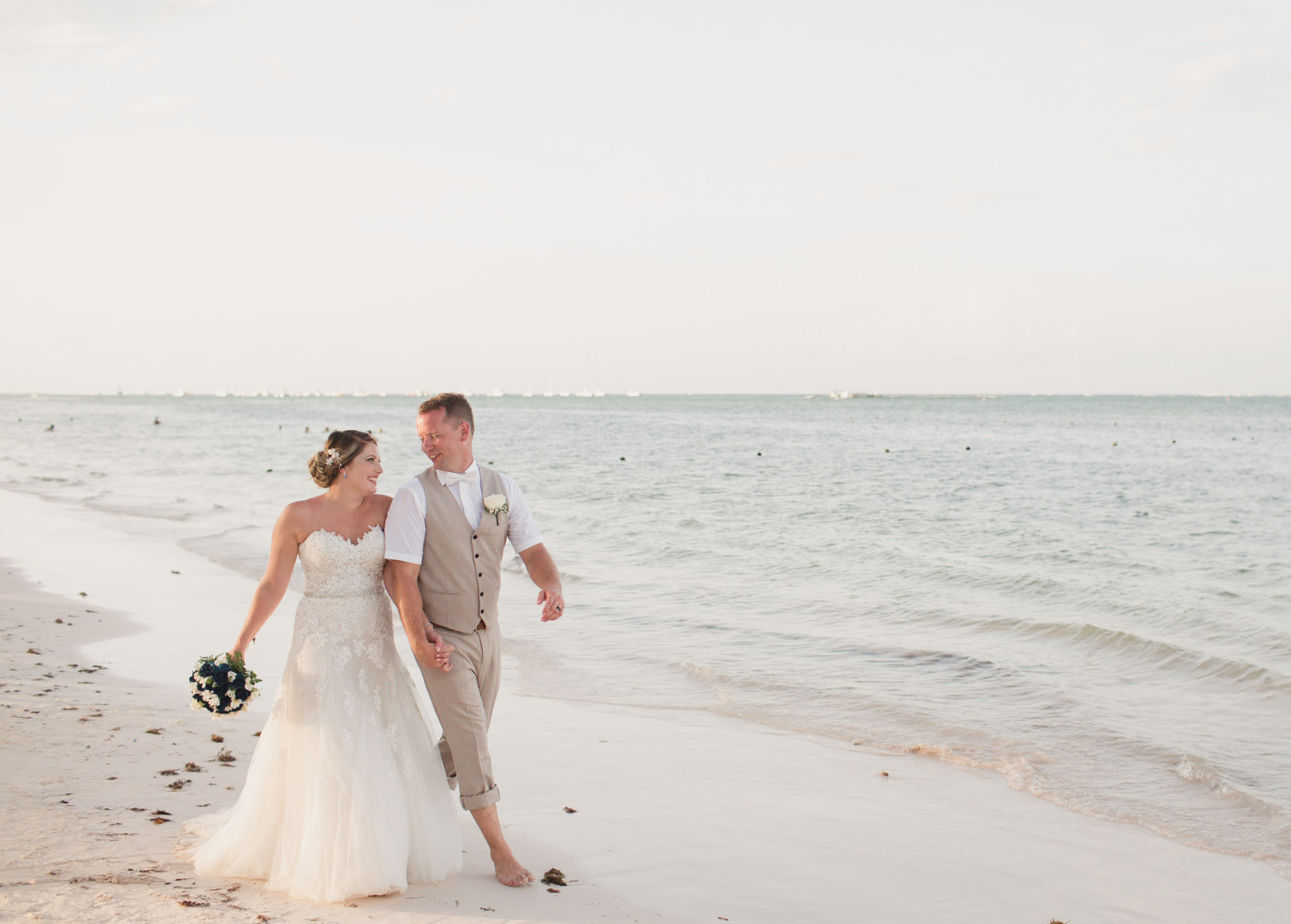 couple walking on a beach playfully