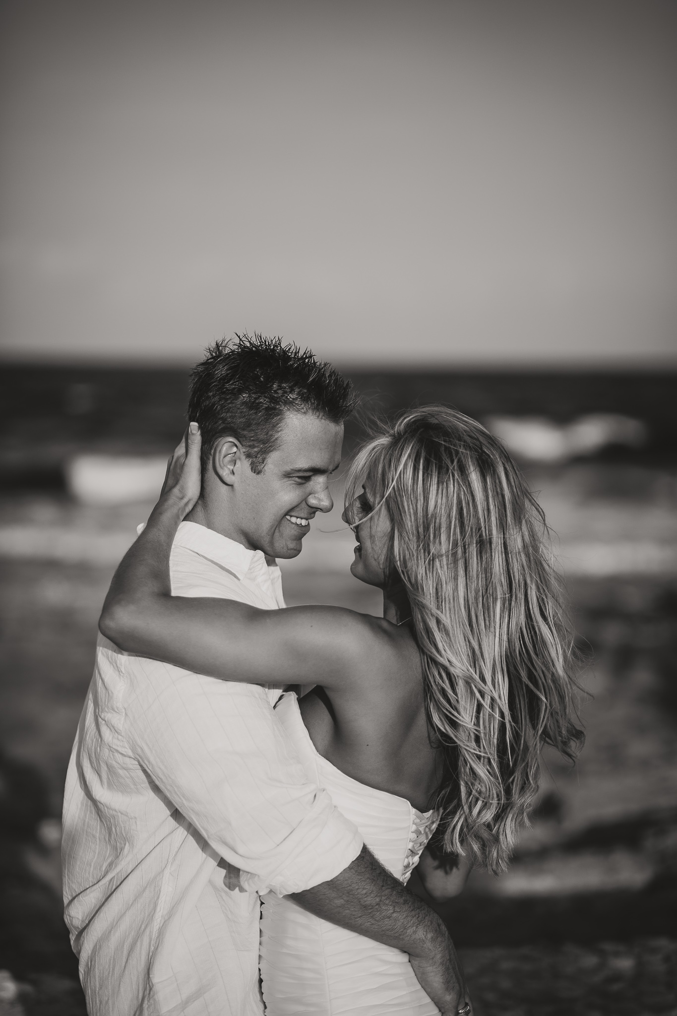 black and white picture of a couple embracing