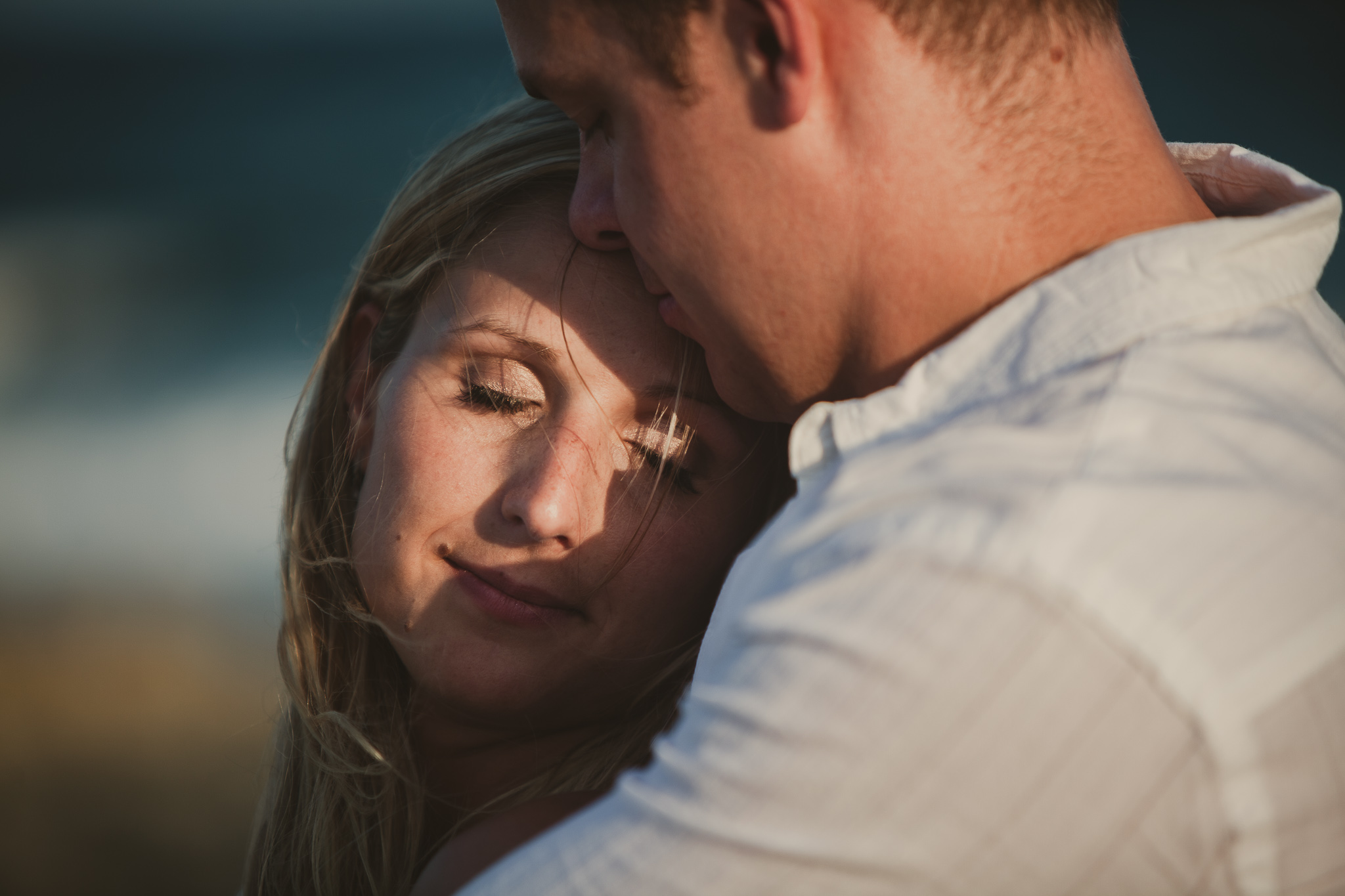 man holding woman from behind