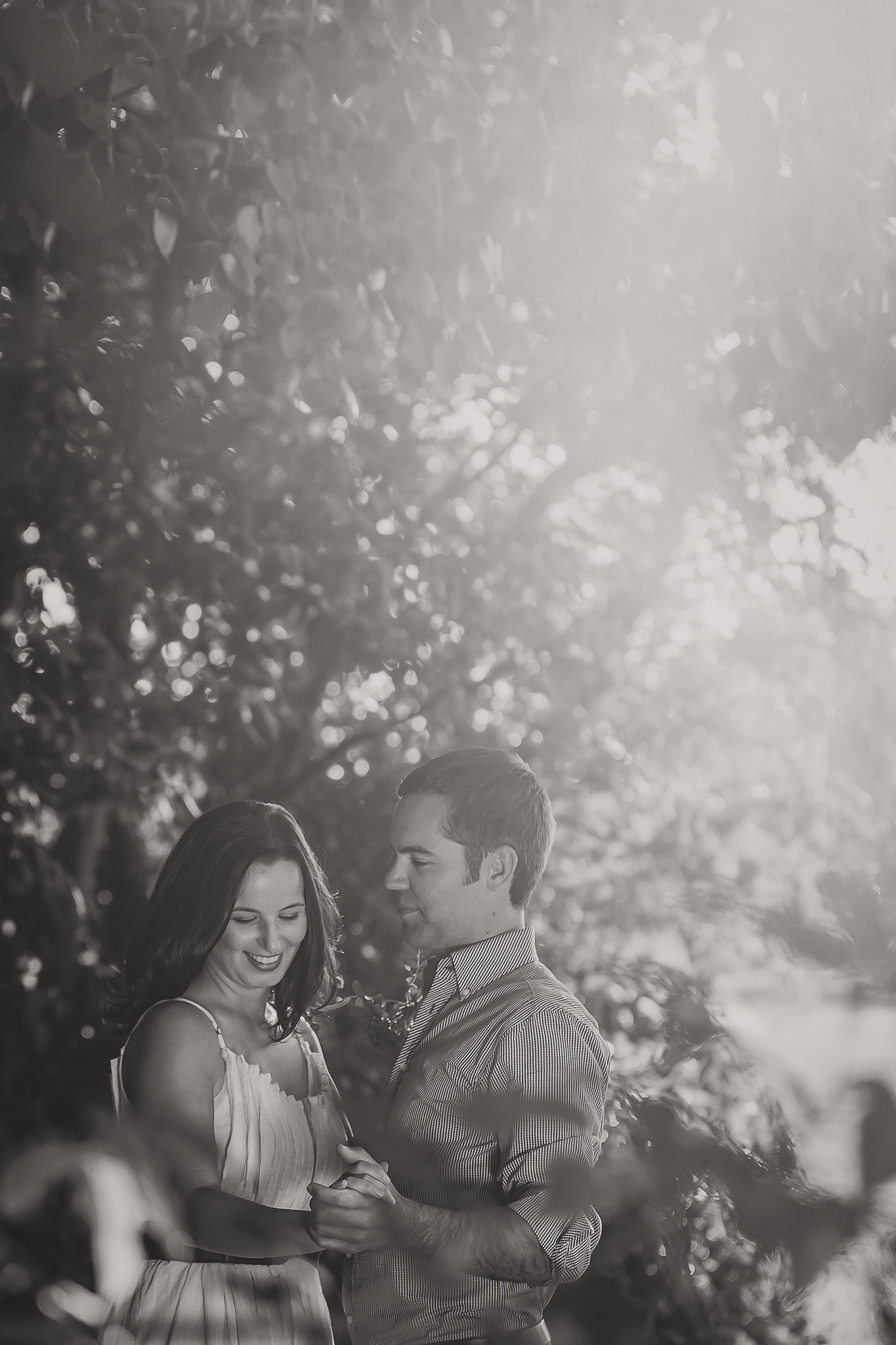 woman and man in the trees black and white