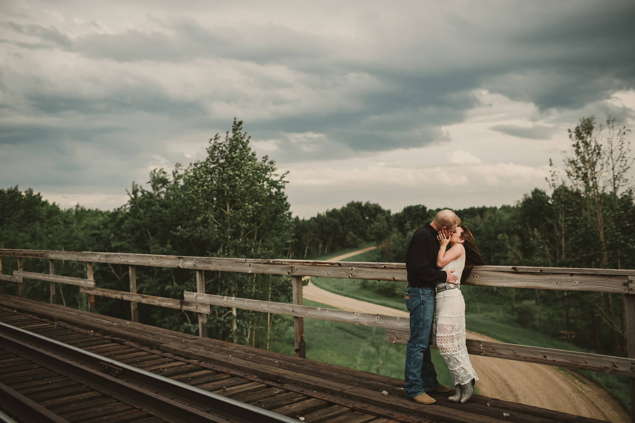 couple kiss on train tressel